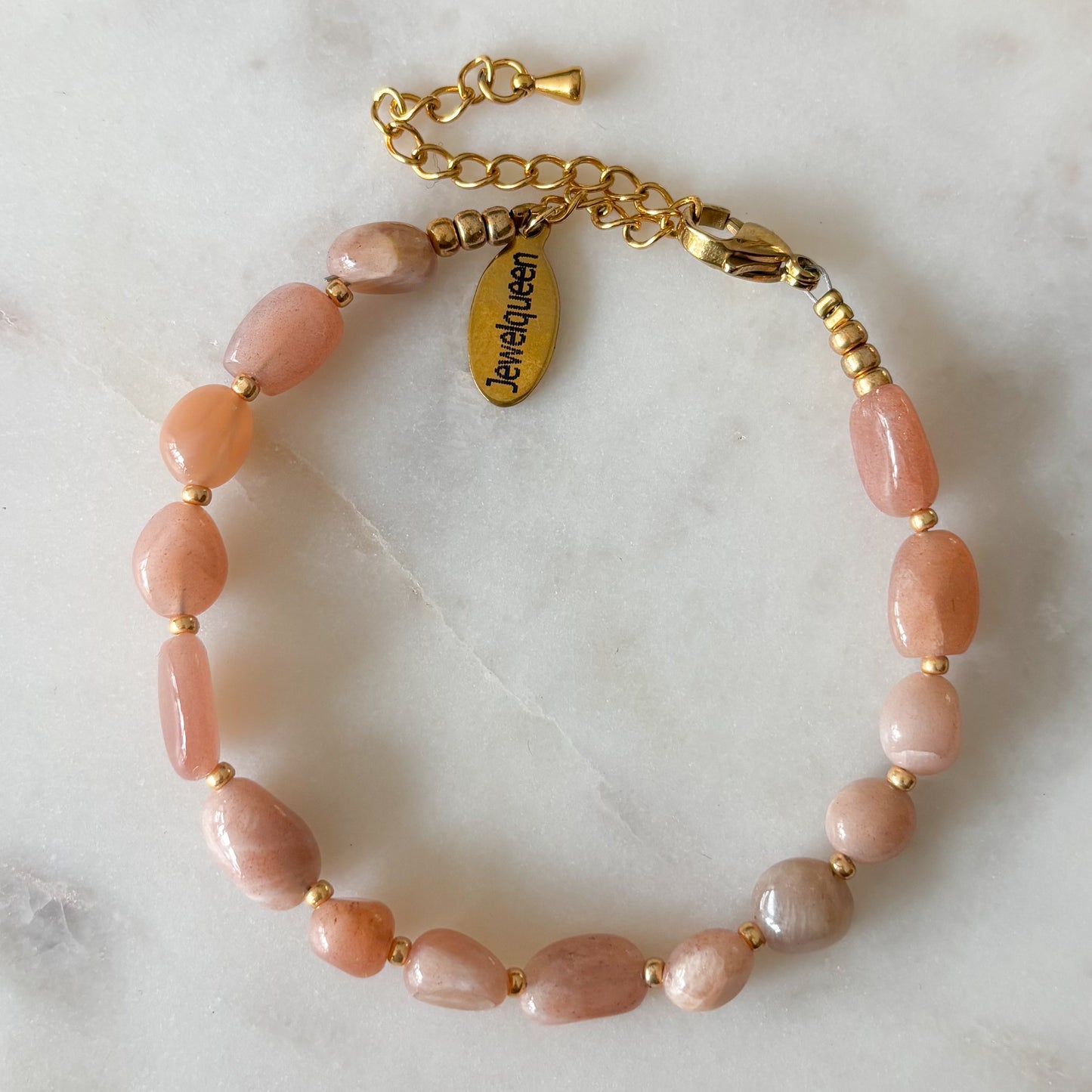 Rvs gouden armband met roze steentjes