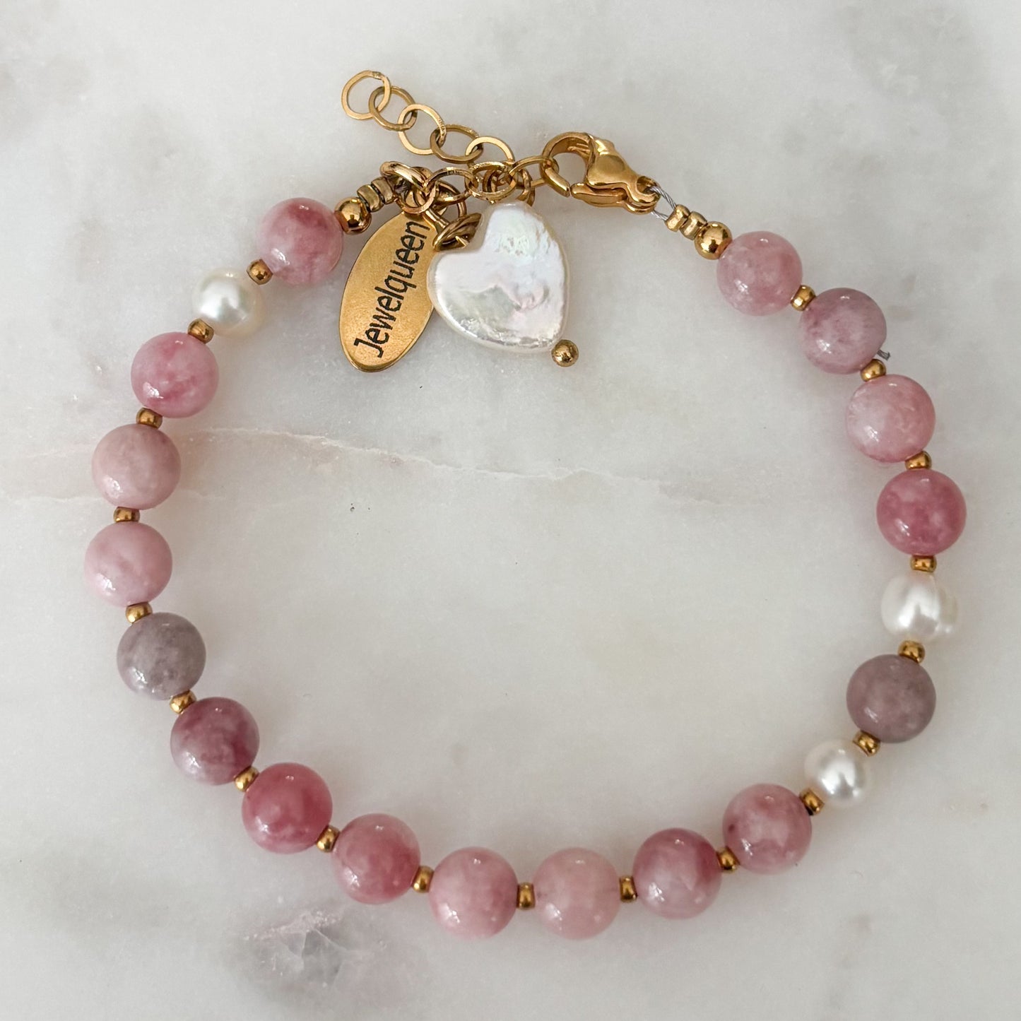 Rvs gouden armband met roze kralen