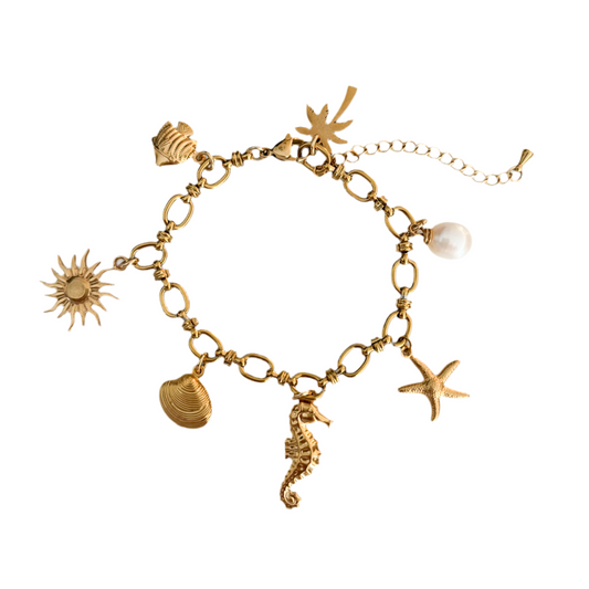 Schakel armband met gouden bedels van rvs zoals zeepaardje,schelp en palmboom