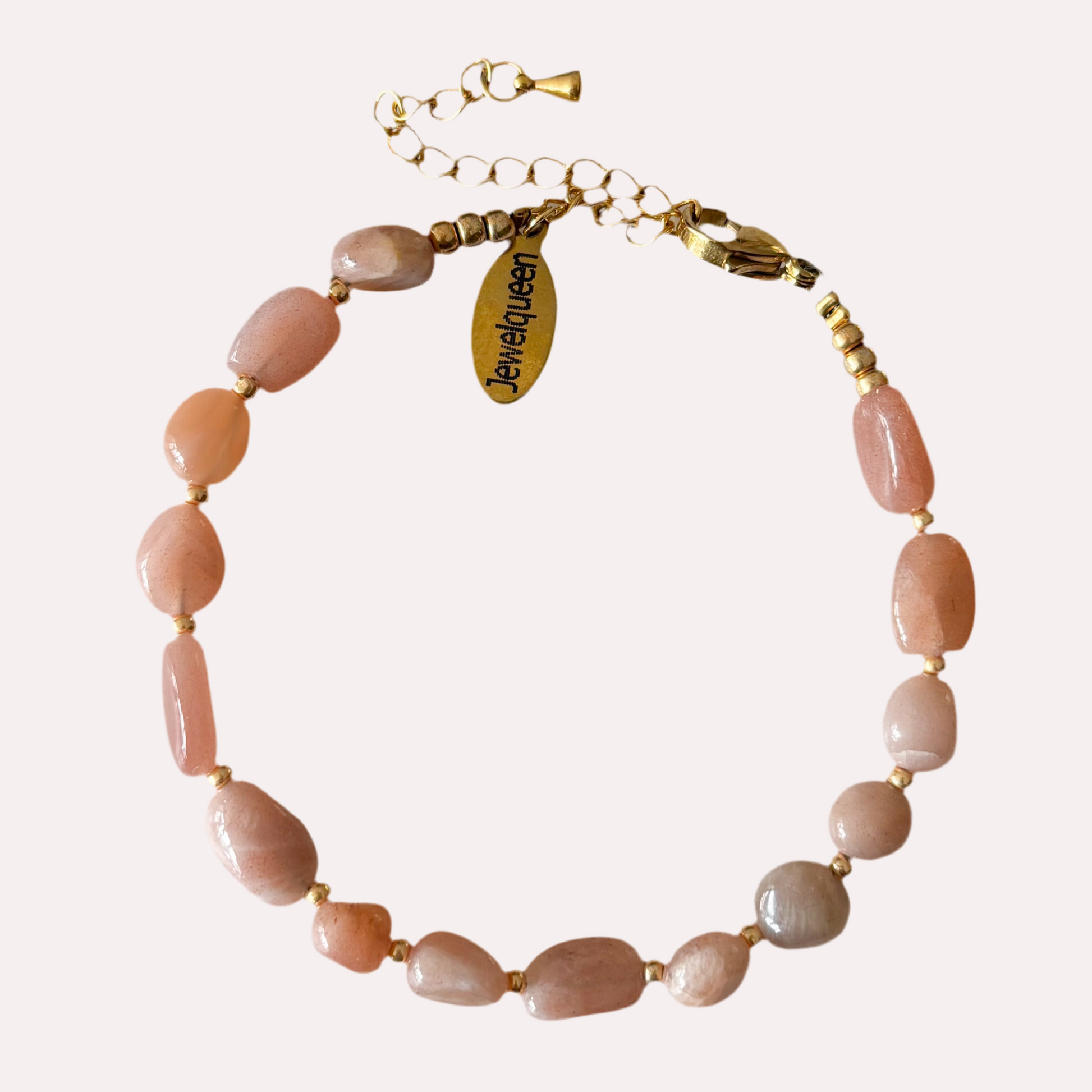 Rvs gouden armband met roze steentjes 
