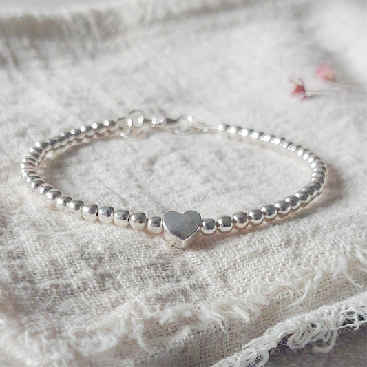 Zilveren .925 sterling armband met bolletjes kralen en een zilver hartje