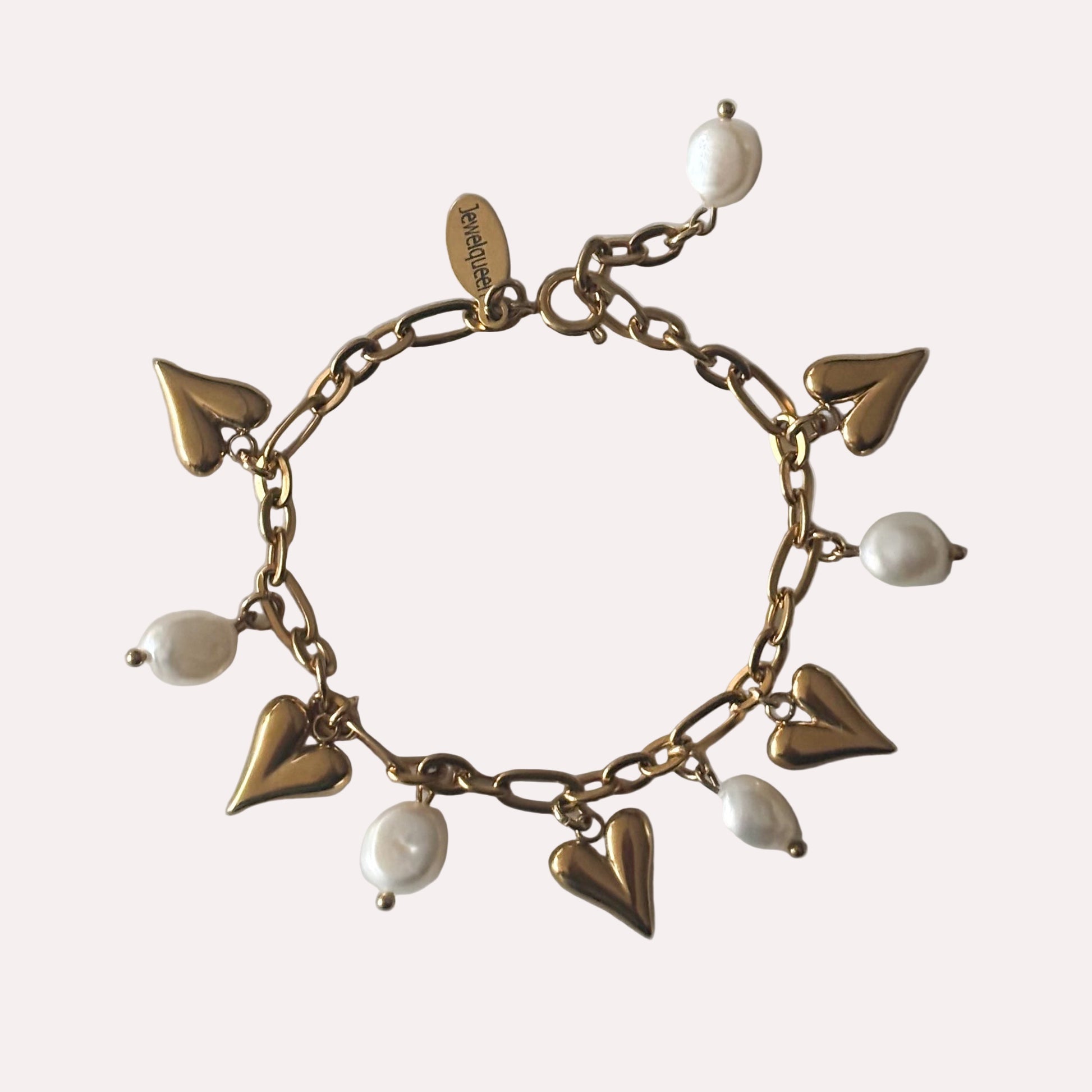 Rvs gouden armband met witte parels en hartjes 