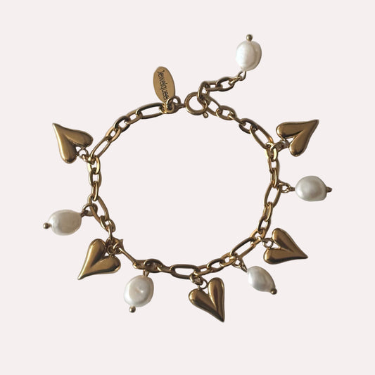 Rvs gouden armband met witte parels en hartjes 