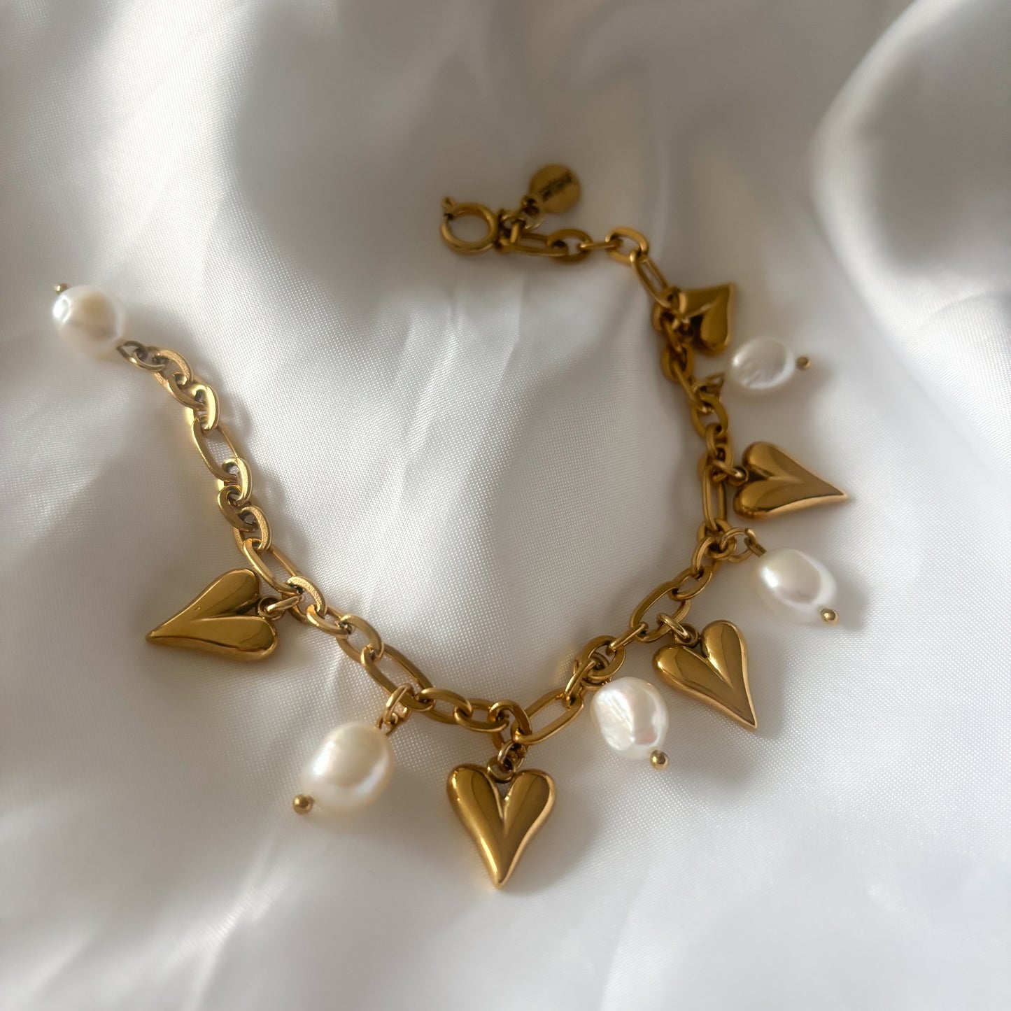 Stainless steel armband met hartjes en parels